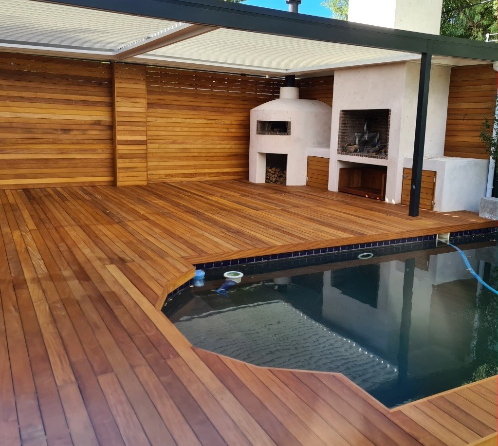 Custom Cape Town timber decking in Garapa hardwood with built-in braai and pizza oven in Bishopscourt.