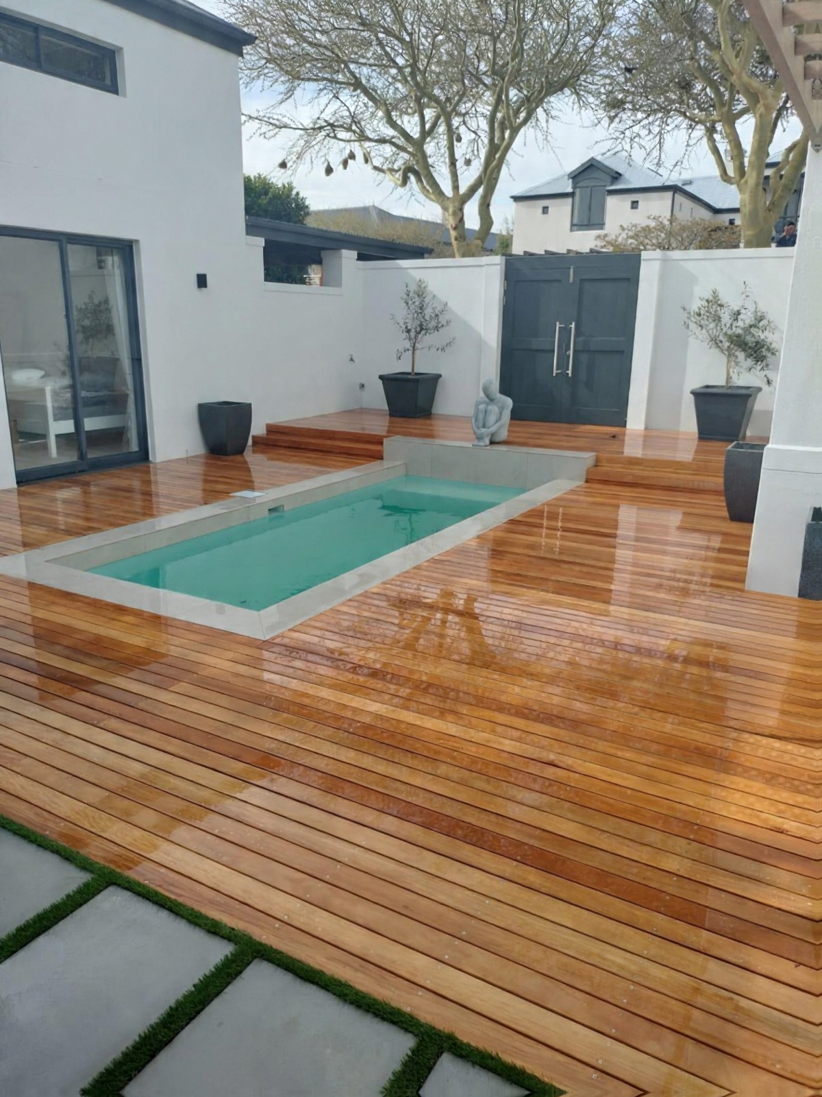 Cape Town Timber Decking: Premium hardwood pool deck integrated with architectural pool in Llandudno.